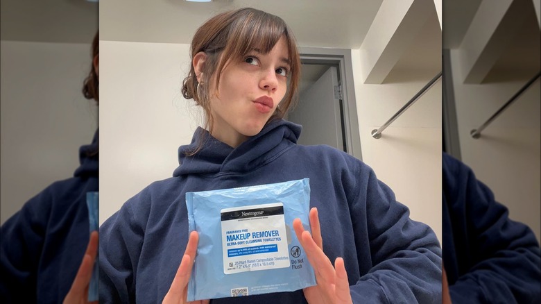 Jenna Ortega posing with makeup wipes