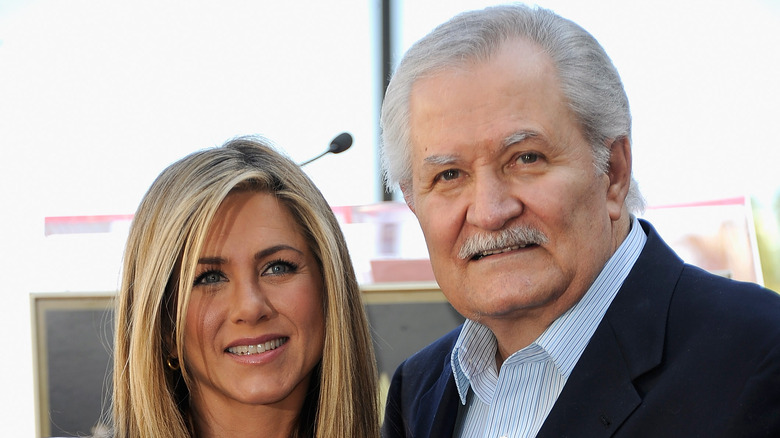 Jennifer Aniston and her father John Aniston at an event. 