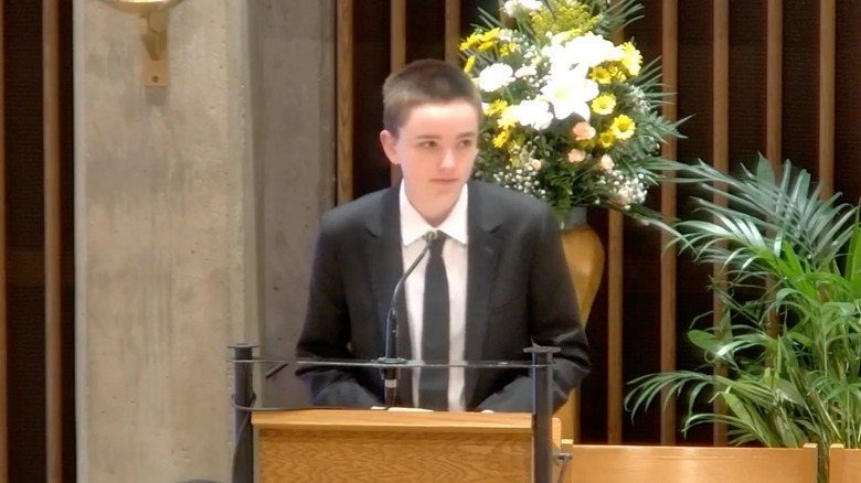 Fin Affleck at the podium during their grandfather's memorial service