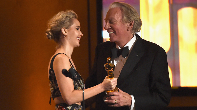 Jennifer Lawrence presenting Donald Sutherland with his honorary Oscar