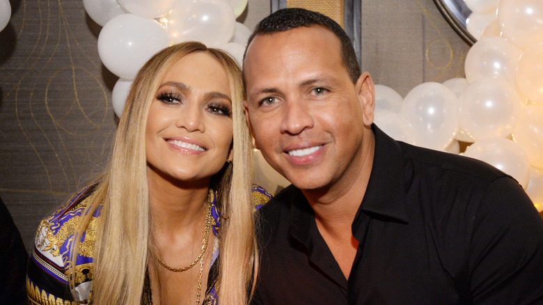 Jennifer Lopez smiles with Alex Rodriguez 