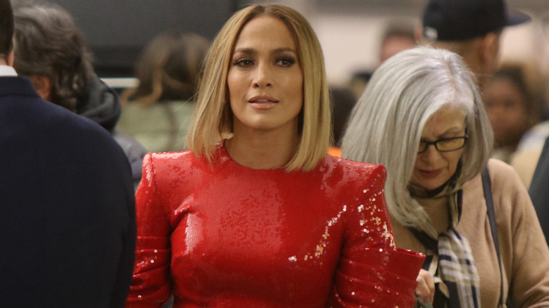 Jennifer Lopez looking thoughtful with a blonde bob