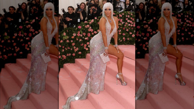 Jennifer Lopez posing on the steps of the Met Gala's pink carpet