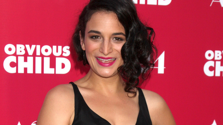 Jenny Slate smiling, wearing black dress