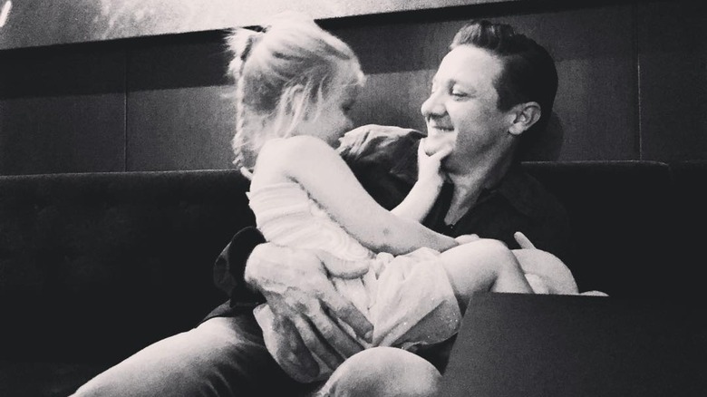 Jeremy Renner holding daughter Ava