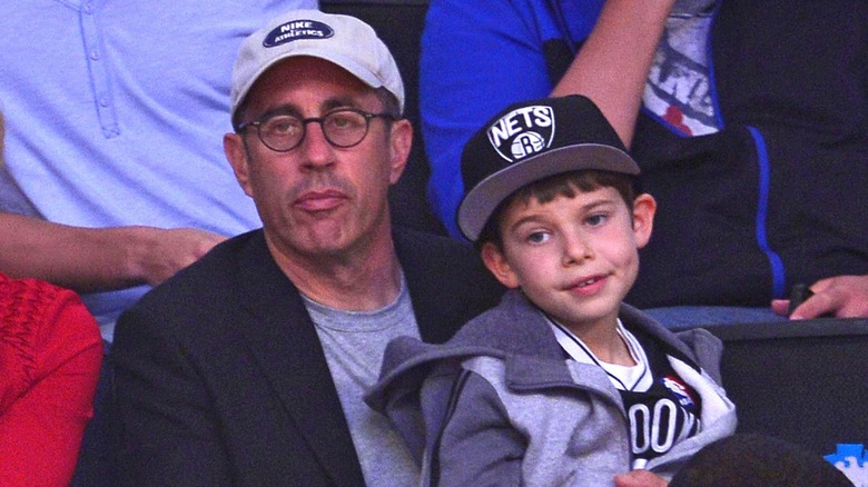 Jerry Seinfeld and son Shepherd watching a sporting event