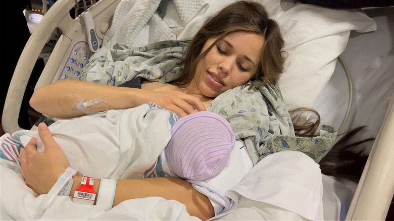 Jessa Duggar Seewald holding newborn baby