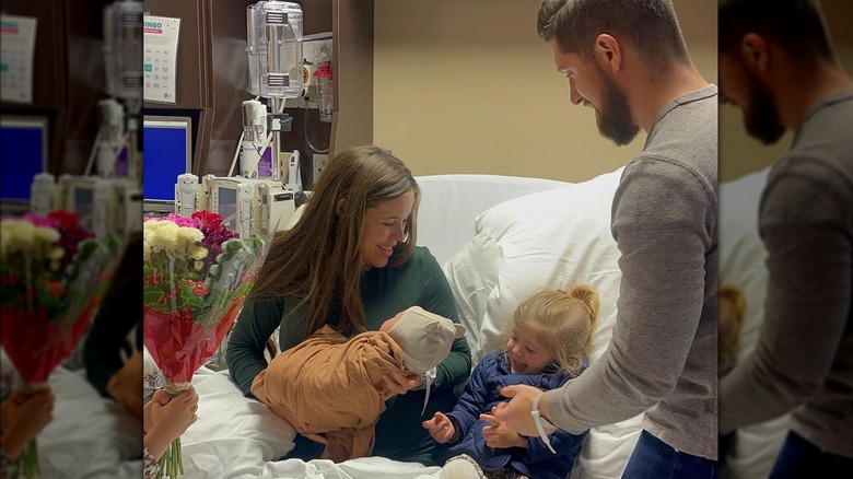 Jessa Seewald holding baby George with daughter Fern