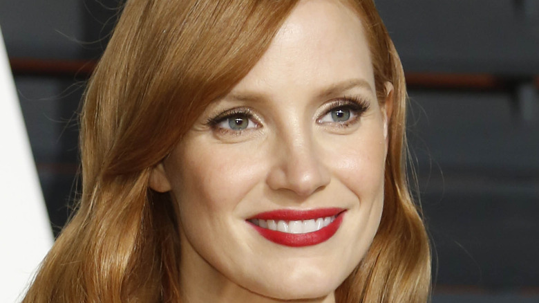 Jessica Chastain smiling for a picture at an event