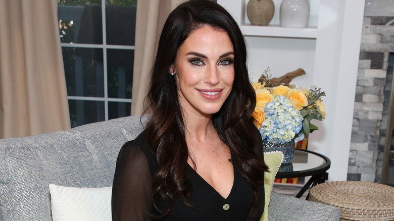 Jessica Lowndes sitting on the set of "Home & Family"