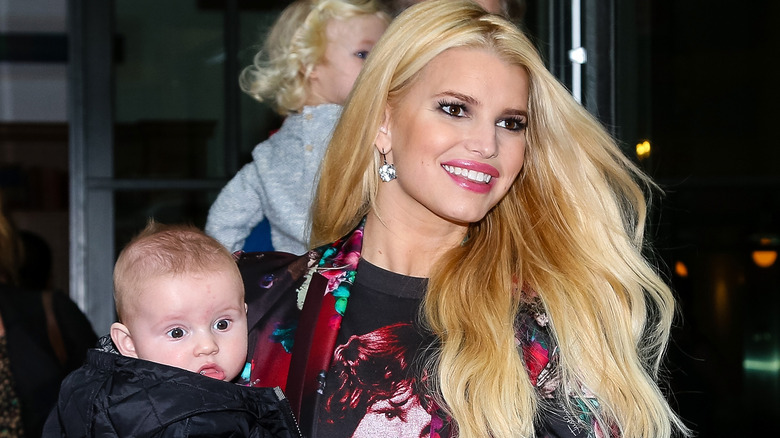 Jessica Simpson holding baby