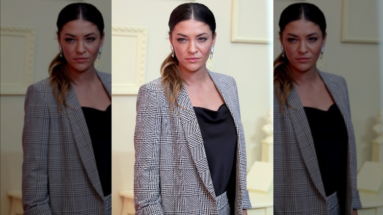 Jessica Szohr posing at fashion presentation