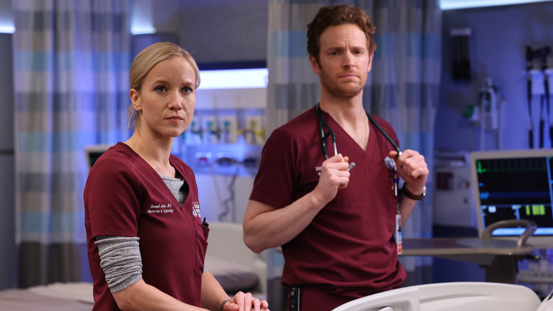 Jessy Schram and Nick Gehlfuss working in Chicago Med