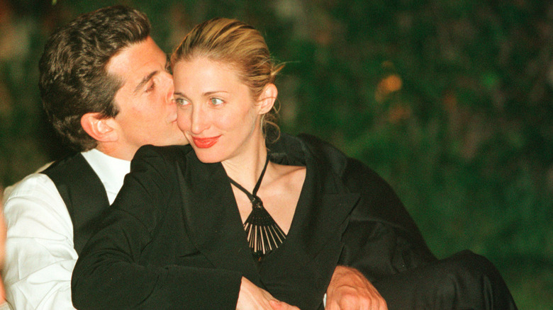 John F. Kennedy Jr. kissing Carolyn Bessette on the cheek