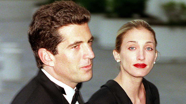 JKF Jr. with Carolyn Bessette outside