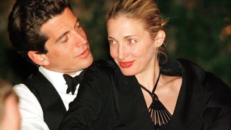 JFK Jr. and Carolyn Bessette embracing