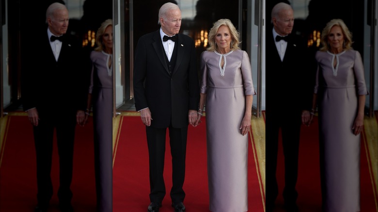 Dr. Jill Biden stands with Joe Biden on red carpet