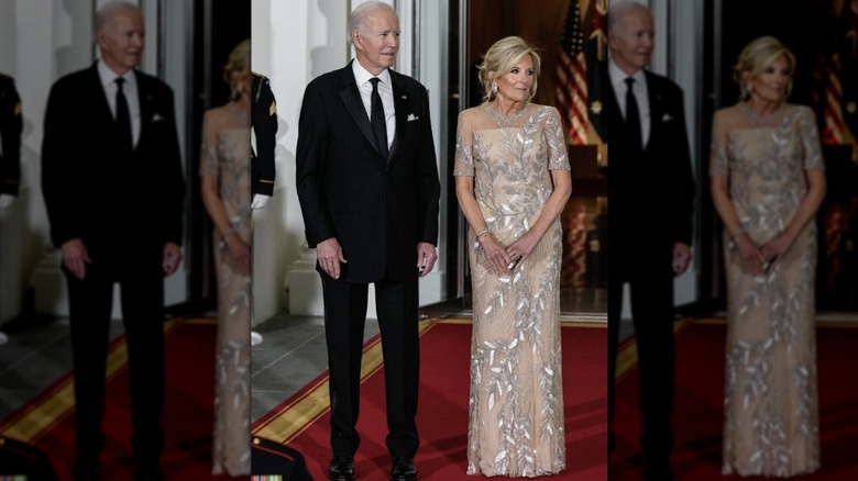 Dr. Jill Biden stands with Joe Biden on red carpet