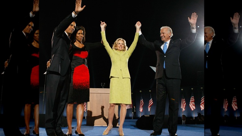 Dr. Jill Biden holds her hands up with Joe Biden and the Obamas