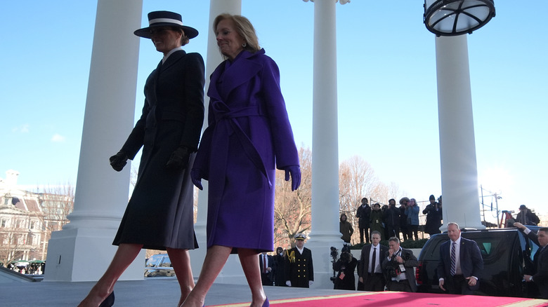 Melania Trump and Jill Biden walk into the White House