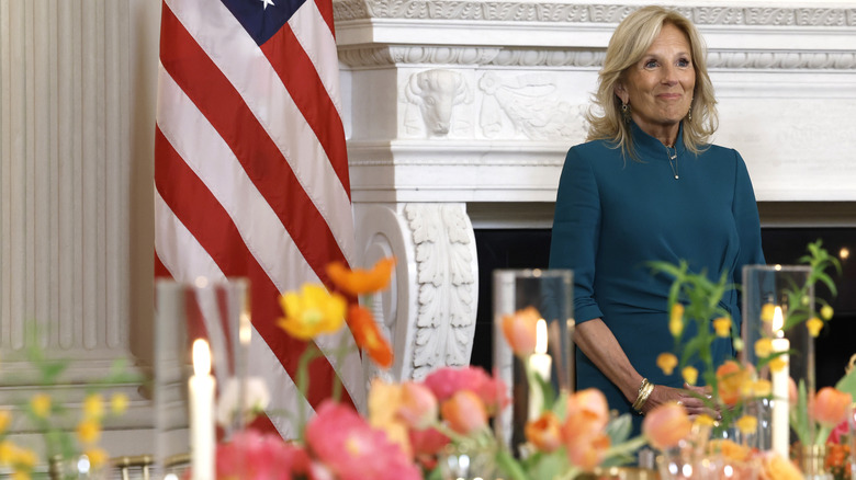 Jill Biden at a table with many flowers