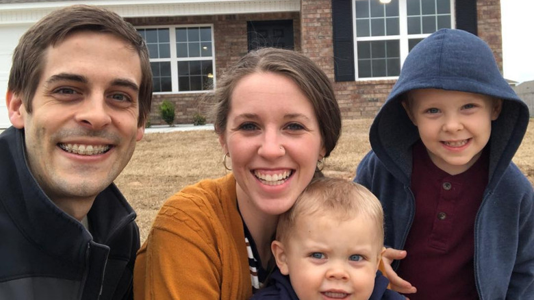 Derick Dillard and Jill Dillard posing with kids