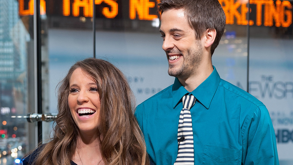 Jill Duggar Dillard and Derick Dillard smile