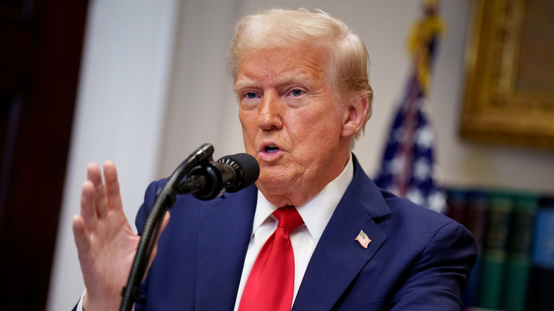 Donald Trump gestures and talks during a chat in the Roosevelt Room