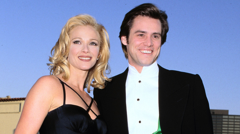 Jim Carrey and Lauren Holly attend a movie premiere