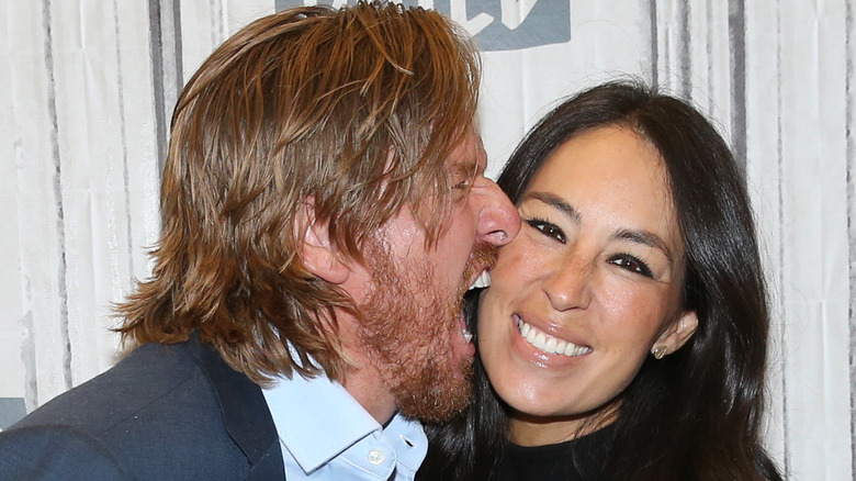 Chip Gaines biting Joanna Gaines' cheek