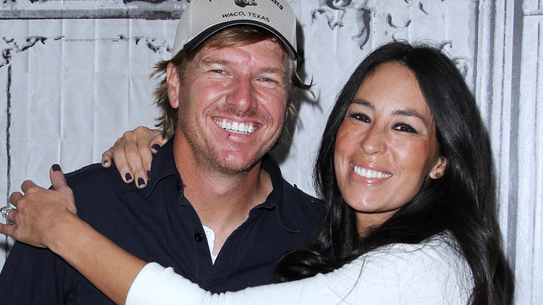 Joanna Gaines hugging Chip Gaines