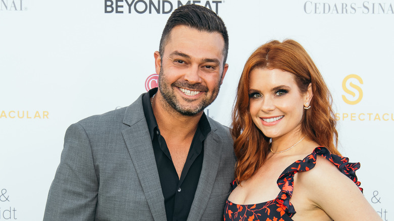 Nick Swisher and JoAnna Garcia Swisher smiling