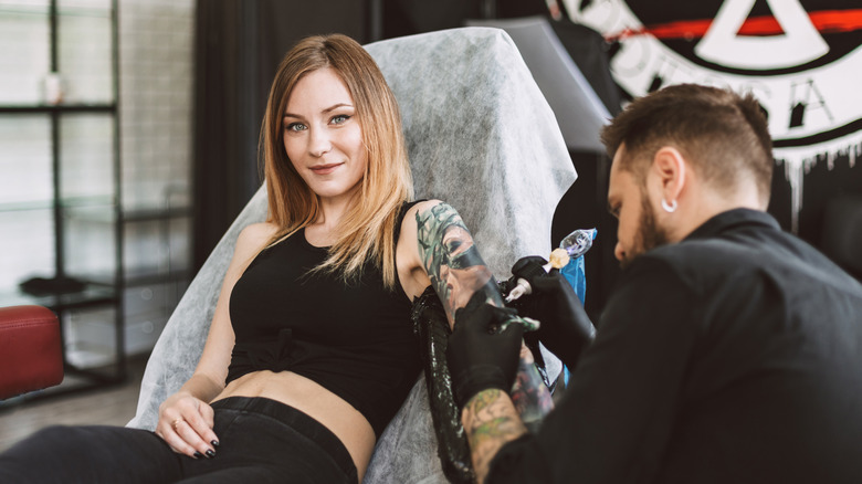 woman getting a tattoo done