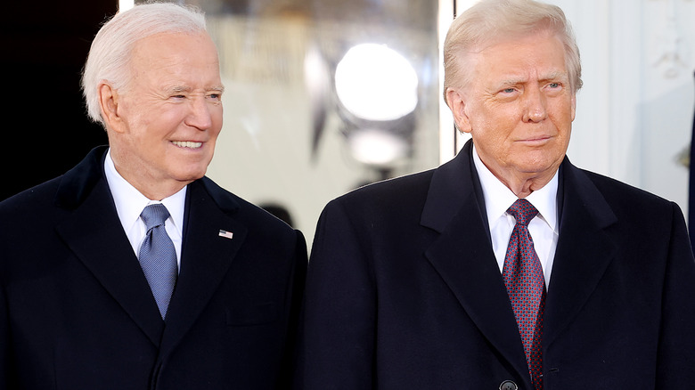 A smiling Joe Biden and Donald Trump standing next to each other