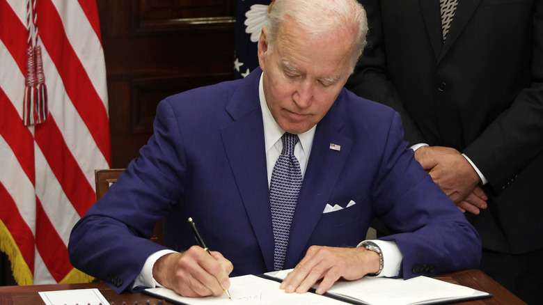 President Joe Biden signing executive order 