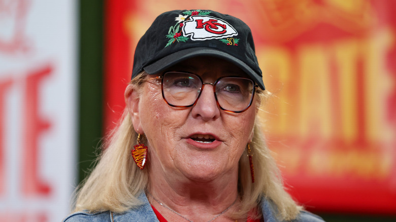 Donna Kelce at the "World's Largest Tailgate" wearing a floral Chiefs hat