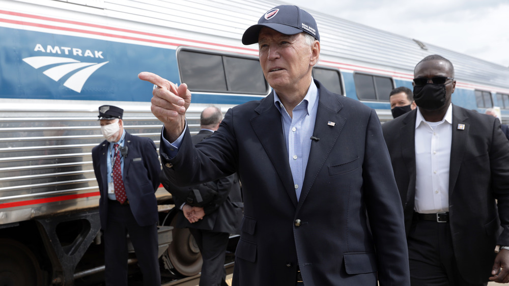 Joe Biden alongside Amtrak train