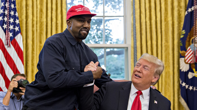 Kanye West shakes hands with Donald Trump