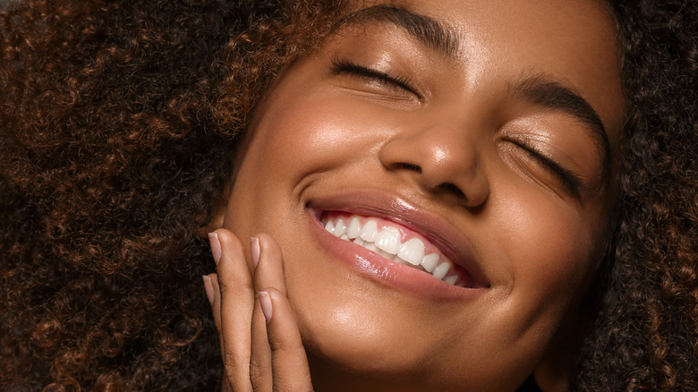 Black woman smiling with clear skin