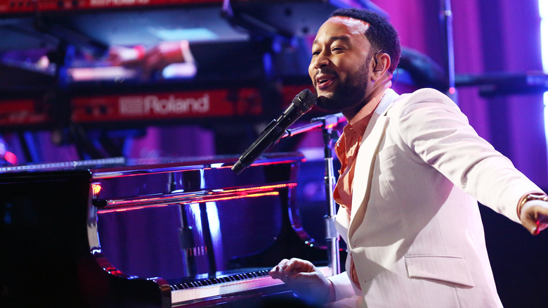 John Legend performing on stage