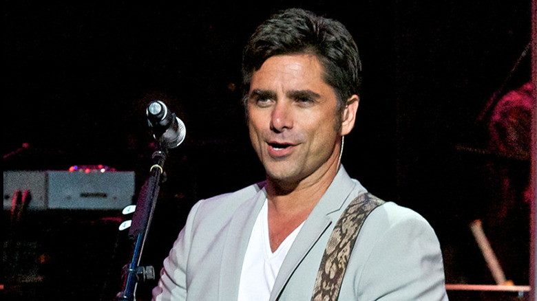 John Stamos rocking out on stage