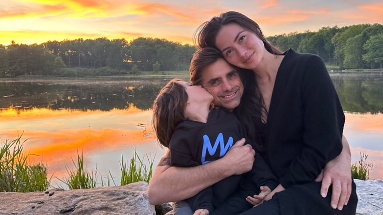 John Stamos hugs his wife and son 