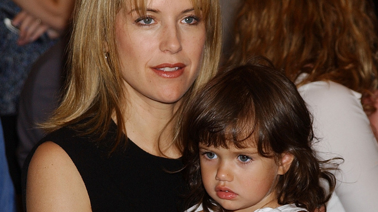 Kelly Preston holding Ella Bleu Travolta as a small child