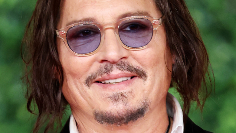 Johnny Depp smiling in 2024