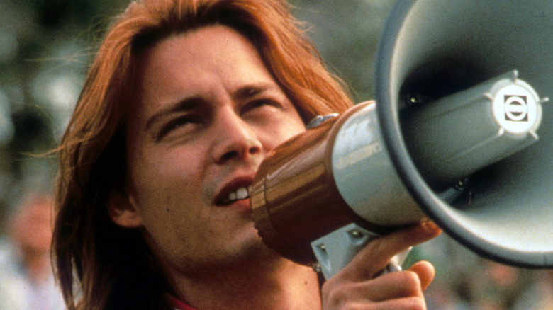 Johnny Depp as Gilbert Grape talking into a megaphone