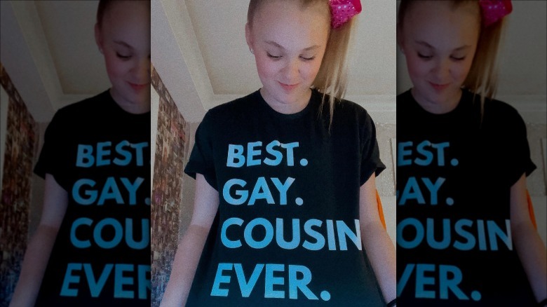 Jojo Siwa wearing a best gay cousin ever shirt on Instagram