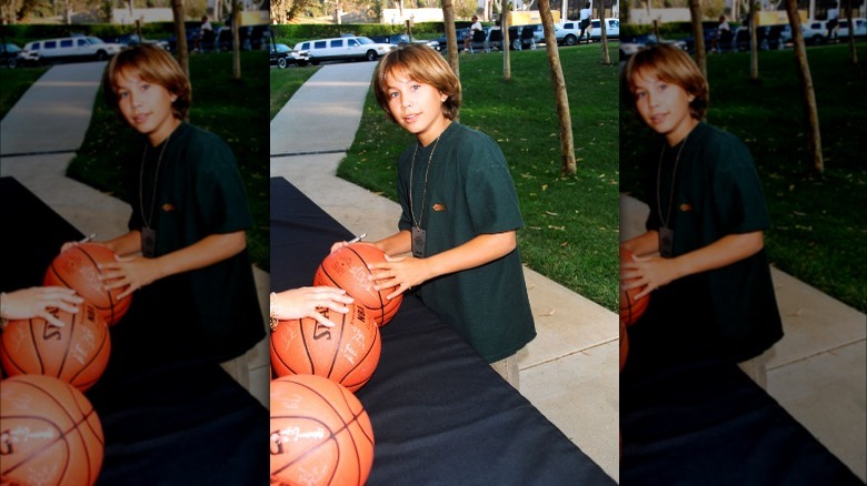 Jonathan Taylor Thomas with a basketball