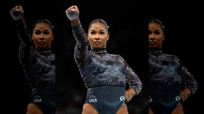 Simone Biles poses in a leotard 