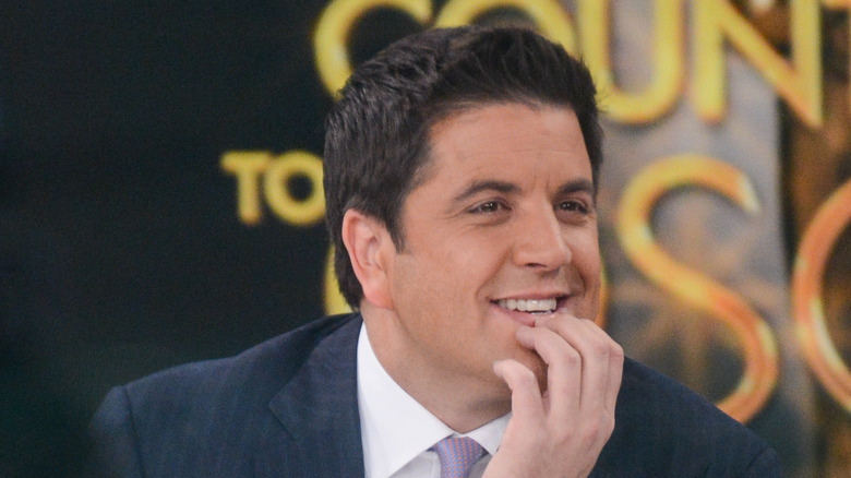 Josh Elliott touching his face