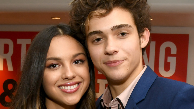 Joshua Bassett and Olivia Rodrgio snuggle up at an event